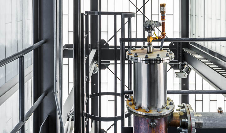 Interior photo of Middle West Spirits featuring distillery equipment.