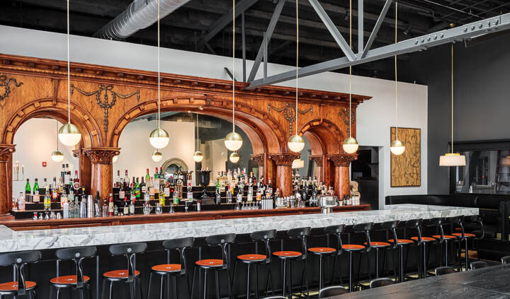 Interior photo of Middle West Spirits featuring the antique bar.
