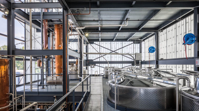 Interior photo of Middle West Spirits featuring distillery equipment.
