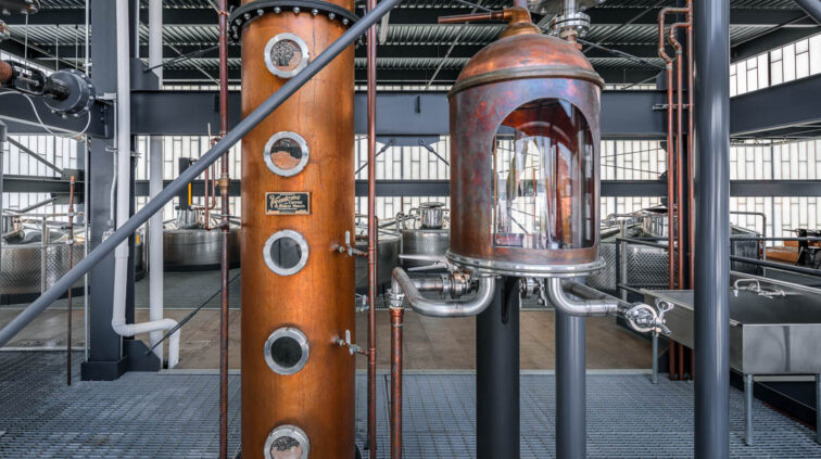 Interior photo of Middle West Spirits featuring distillery equipment.
