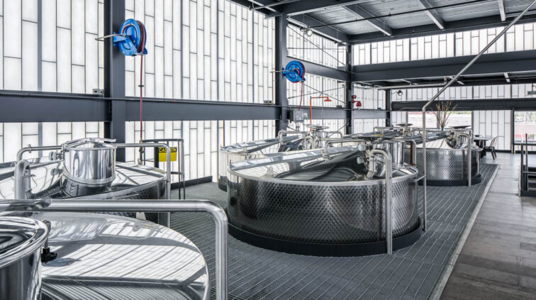 Interior photo of Middle West Spirits featuring distillery equipment.