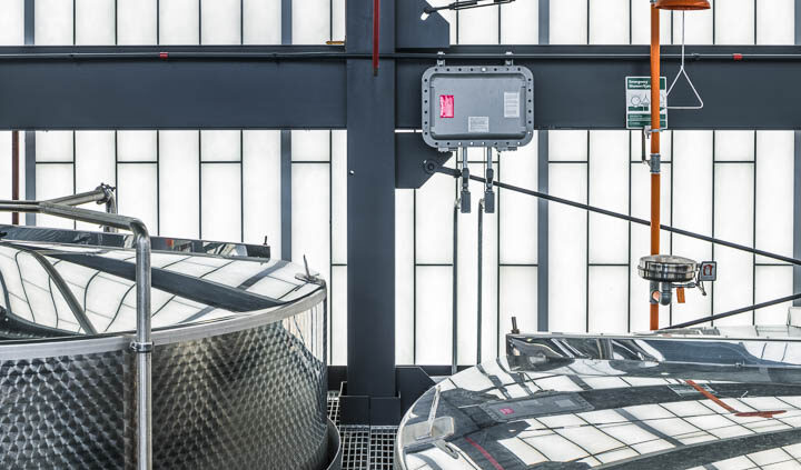 Interior photo of Middle West Spirits featuring distillery equipment.