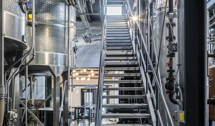 Interior photo of Middle West Spirits featuring distillery equipment.