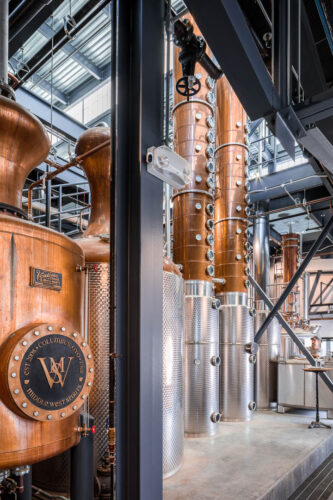 Interior photo of Middle West Spirits featuring distillery equipment.
