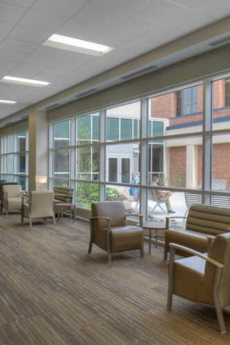 Interior photo of Fairfield Medical Center Surgery Addition featuring a waiting area with table and chairs.