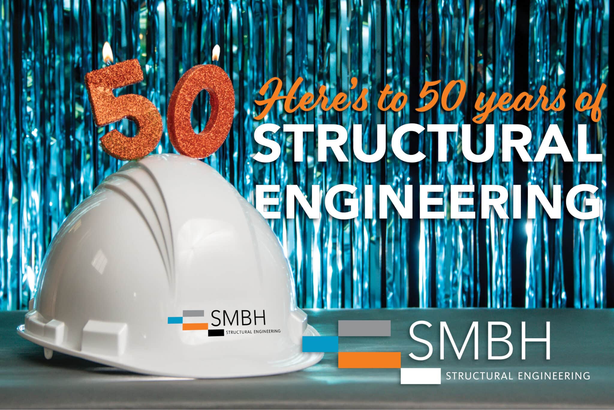 A white SMBH hard hat with sparkly orange candles in the shape of an 5 and a 0 on a shiny fringe background.