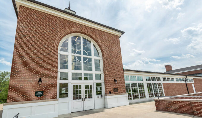 Exterior photo of Nelson Commons at Ohio University in Athens, Ohio. The building has a brick exterior.