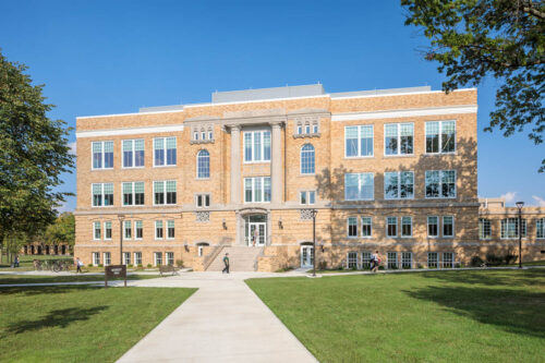An exterior view of Moseley Hall at Bowling Green State University. This multi-story building features a brick exterior with large windows on all 4 floors of the building.