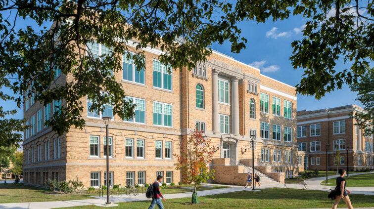 An exterior view of Moseley Hall at Bowling Green State University. This multi-story building features a brick exterior with large windows on all 4 floors of the building.