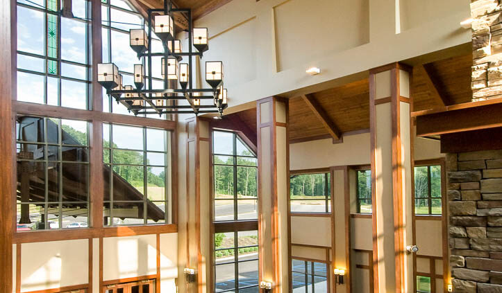 Bible Center Church Interior featuring stone, wood, and glass.