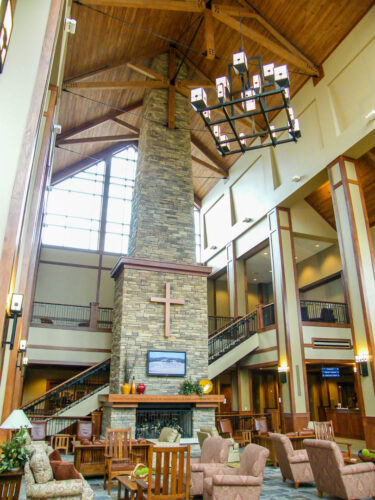 Bible Center Church Interior featuring stone, wood, and glass.